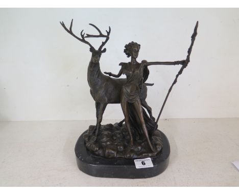 A modern bronze figure of a stag and lady on a marble base