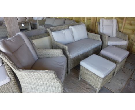 A Bramblecrest Oakridge two seater sofa with cushions and two chairs with stools