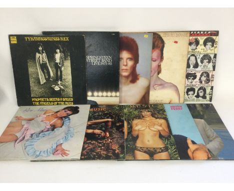 Two bags containing 20 LPs by various artists including David Bowie, Tyrannosaurus Rex, Roxy Music, The Rolling Stones and ot