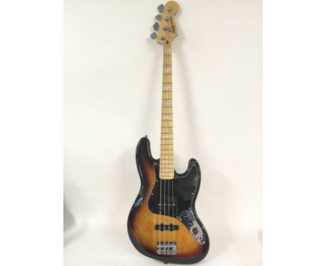 A Fender Squier jazz bass guitar. Comes with a soft carry case.