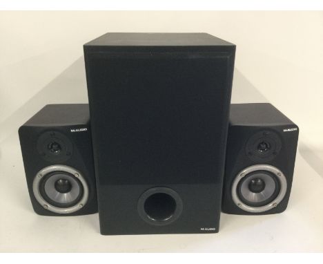 A boxed M-Audio Studiophile LX4 2.1 reference monitor speaker system.