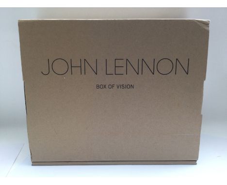 A John Lennon 'Box Of Vision' CD storage, catalogue and book plus contents.