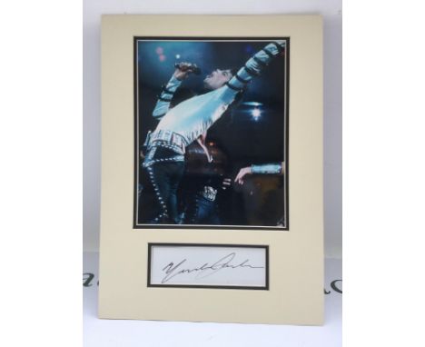 A signed photo display of Michael Jackson with COA. Please note that we are not experts in this field and can offer no guaran
