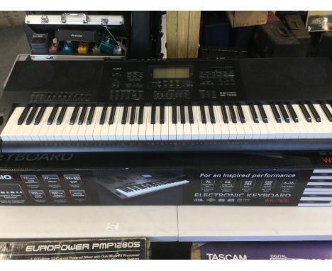 A boxed Casio WK 7600 keyboard.