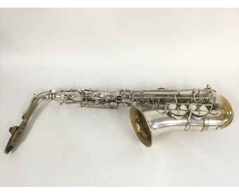 A Jerome Thibouville Lamy Alto saxophone with a metal streamline mouthpiece. Comes supplied with a wooden carry case and acce