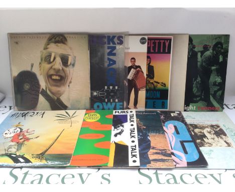 Two bags containing 23 new wave, rock and pop LPs by various artists including Elvis Costello, Dr Feelgood, Nick Lowe and oth