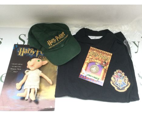 A collection of Harry Potter related items comprising a carded Dobby figure which was only available at the premiere party, c