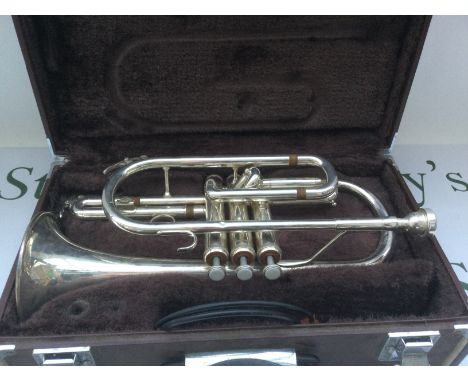 A cased Yamaha trumpet.