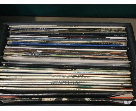 Eight record cases of LPs by various artists including The Small Faces, Bruce Springsteen, Elvis Presley and others.