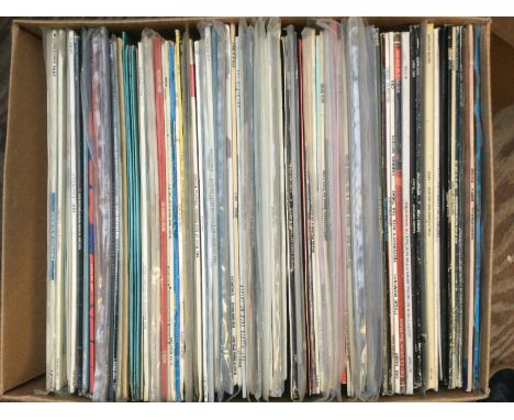 Four boxes of LPs, 12" and 7" singles plus some CDs. Various artists including Massive Attack, Ice Cube, Madonna and many mor
