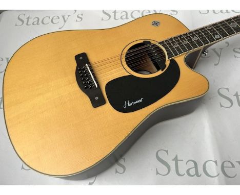 A Hartwood Villanelle 12" string Acoustic Guitar with pickup and cutaway and Celtic cross fret markers. As new in original bo