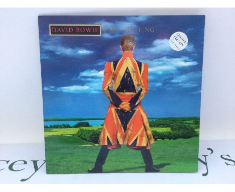A limited edition first UK pressing of the David Bowie LP 'Earthling' housed in a gatefold sleeve, 74321 44944 1. Sleeve VG+,