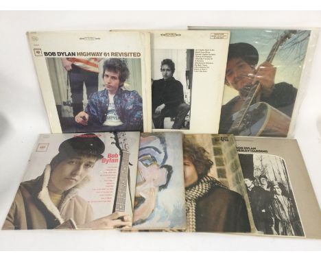 Two bags containing 15 Bob Dylan LPs comprising 'Blonde On Blonde', 'Nashville Skyline', 'Highway 61 Revisited' and others