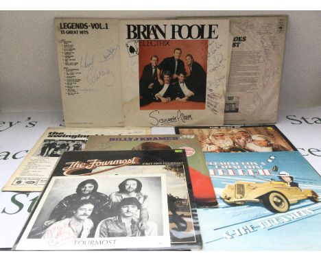 A collection of signed LPs by various artists including Billy J Kramer, Brian Poole & The Tremoloes, Freddie & The Dreamers a