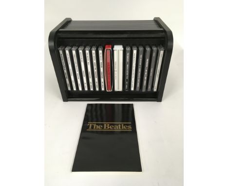 A Beatles 'bread bin' CD box set complete with booklet.