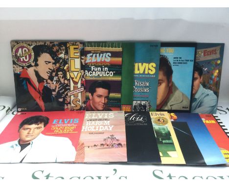 Two bags containing 23 Elvis Presley LPs including 'Moody Blue', 'Harem Holiday' and others. Includes two promo LPs.