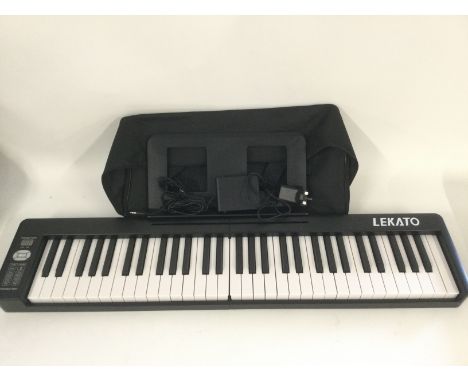A Lekato folding keyboard with original case and accessories and folding stool (2).