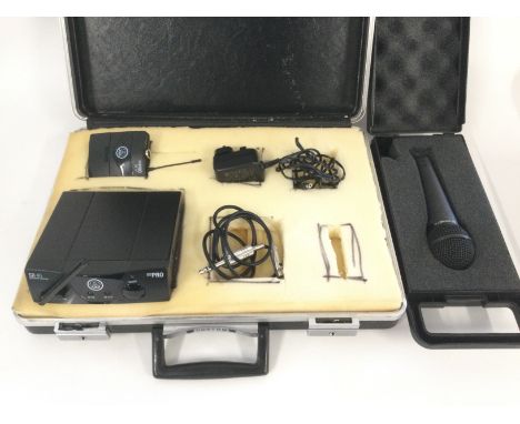 An AKG SR40 mini pro wireless receiver and a Behringer XM8500 microphone (2).