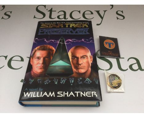 A William Shatner signed Star Trek hardback novel 'Preserver' plus two metal badges.