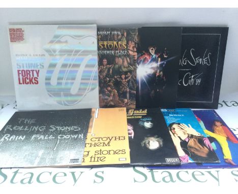 Two bags containing six Rolling Stones LPs plus a 12" single and two CD box sets comprising 'A Bigger Bang', 'Another Time, A