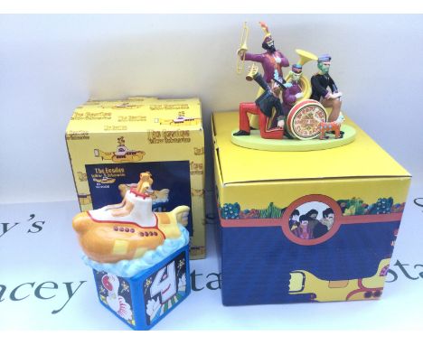 Two boxed Yellow Submarine ceramic items comprising a limited edition Coalport Sgt Pepper's band figural group and a money bo