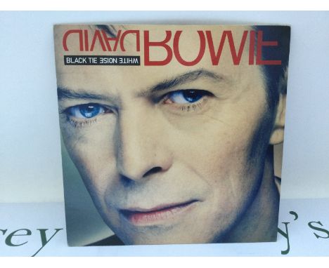 A first UK pressing of the David Bowie LP 'Black Tie White Noise', 74321 13697 1. Sleeve Ex, Vinyl Ex.