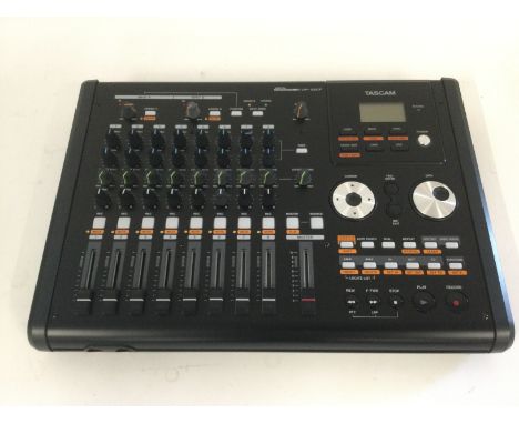 A boxed Tascam DP-02CF digital portastudio.