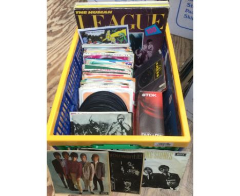A box of 7" singles, EPs and LPs by various artists including The Rolling Stones, Traffic, Muddy Waters and others.