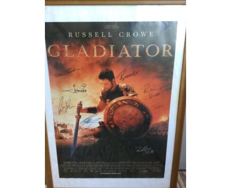 A multi signed Gladiator film poster signed by Russell Crowe, Ridley Scott, Richard Harris, Derek Jacobi and others, framed a