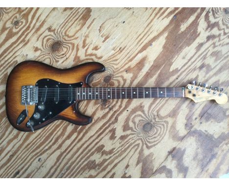 A scratch built Partscaster Strat style electric guitar comprising a swamp ash body fitted with EMG active pickups, Kahler lo