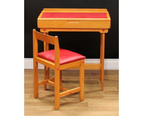 A retro vintage child's school desk and chair, hinged writing surface, 72cm high, 66cm wide (2) 
