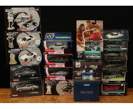 Carrera James Bond cars, comprising 25467 Evolution Aston Martin Vanquish, window boxed and 25735 Evolution Aston Martin D.B.