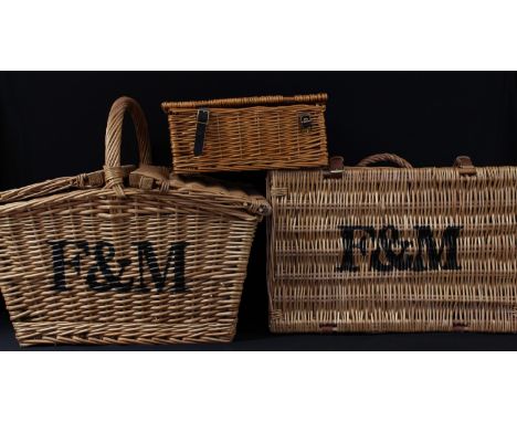A wicker picnic hamper, two others (3) 