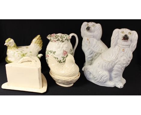 A large pair of Victorian Staffordshire mantel dogs; a 19th century Staffordshire cheese dome and cover; a hen egg basket; an