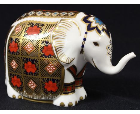 A Royal Crown Derby paperweight, Elephant, 1128 pattern, trunk raised, silver stopper 