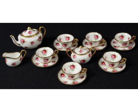 A Hammersley miniature tea set for six, teapot, sucrier and cover, milk jug, six cups and saucers, printed with red roses, th