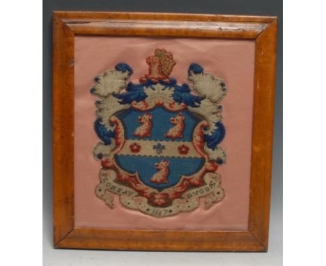 A 19th century Berlin woolwork armorial panel, depicting the arms and motto of Rugby School, on a silk ground, 31.5cm x 28.5c