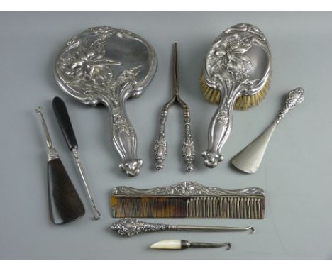 A SILVER BACKED DRESSING MIRROR, HAND BRUSH & COMB with elaborate raised floral decoration, Chester 1909, a parcel of six man