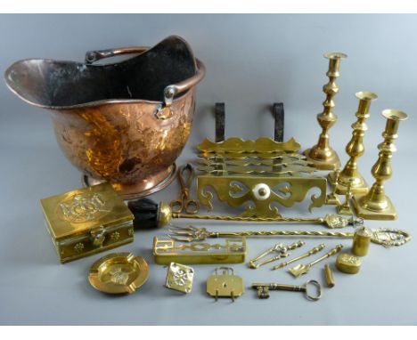 A GOOD COPPER HELMET COAL SCUTTLE with swing handle and a parcel of brass candlesticks and minor brass items