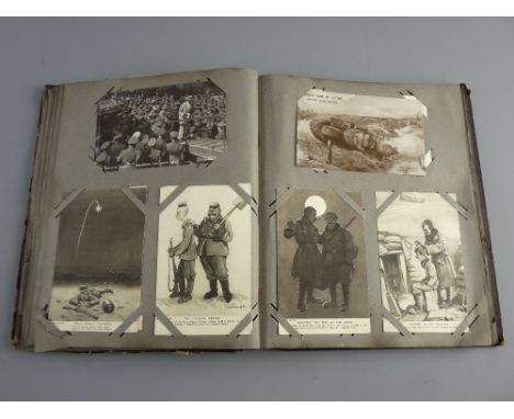 A VINTAGE ALBUM CONTAINING EIGHTY PLUS POSTCARDS & NEEDLEWORK SILKS, mostly First World War including Crown copyright officia