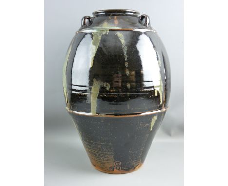 JIM MALONE (1946-) CONTEMPORARY POTTERY THREE HANDLED BULBOUS VASE decorated with a Tenmoku glaze on a segmented and banded b