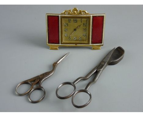 A SMALL GILT METAL FRAMED SQUARE DIAL TRAVEL CLOCK with side oblong red enamel panels, in its original jeweller's box, a 19th