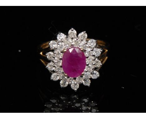 A new ruby and diamond cluster ring, central oval ruby, approx 1.35ct, surrounded by a twenty eight stone pave diamond encrus