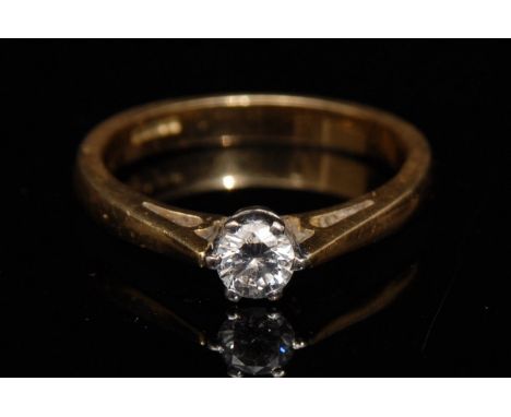 A diamond solitaire ring, round brilliant cut, approx 0.25ct, platinum claws,18ct gold shank, size M, 3.9g gross