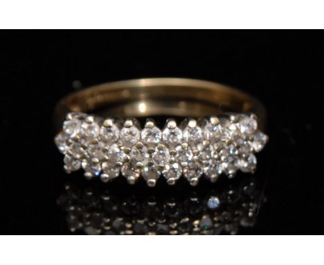 A thirty one stone diamond set half eternity ring, the diamond crest arranged in three rows, 9ct gold shank, size L, 2.6g gro