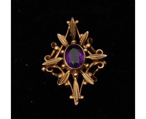 An amethyst cruciform dress ring, central oval amethyst set within an open floral cruciform frame, 9ct gold shank, size L, 5.