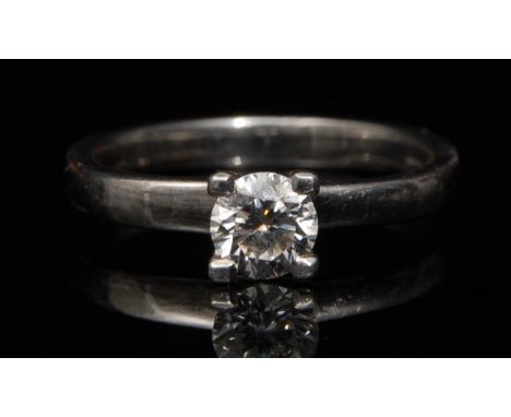 A diamond solitaire ring, round brilliant, 0.41ct, clarity SI1, colour G, mounted to a platinum shank, size H1/2, 3.55g gross