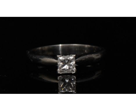 A princess cut diamond solitaire ring, 0.50 ct, clarity VS2, colour F, mounted to a platinum shank, size M, 5.03g gross, with