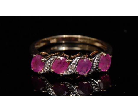 A new ruby and diamond ring, four oval pink ruby's each divided by an illusion set diamond accent, 9ct gold shank, size L, 1.