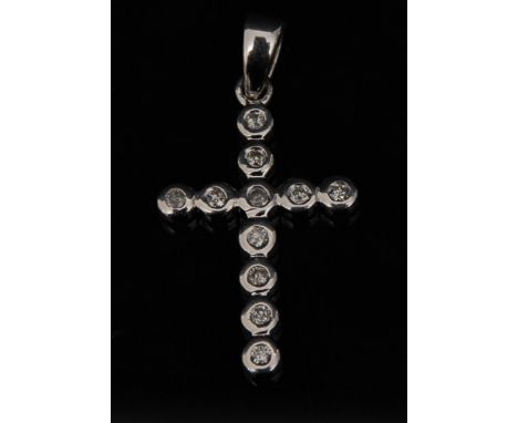 A new eleven stone diamond cross pendant, 9ct white gold ring section cross, stamped 375, 23mm long, 1.1g gross